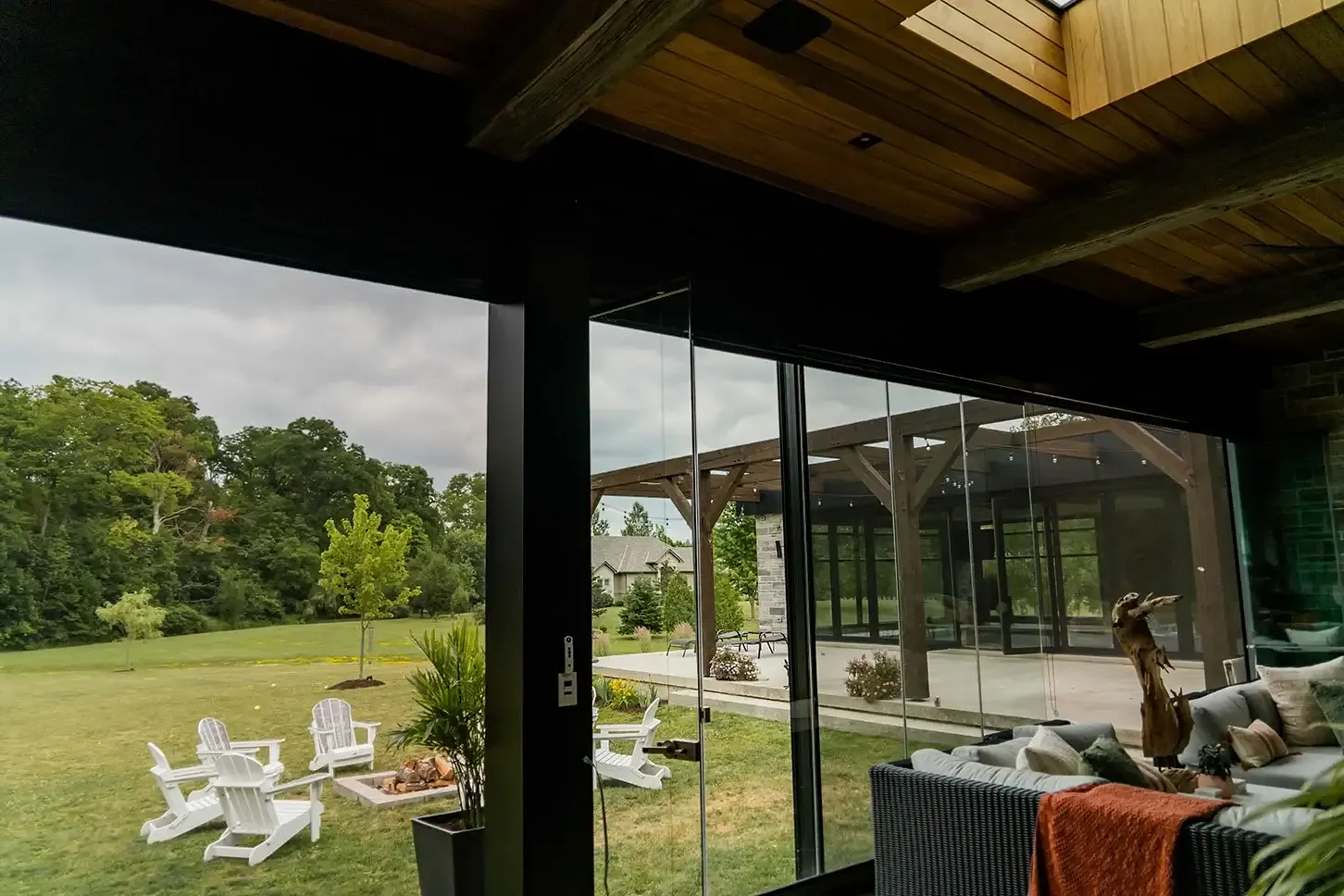 Pavilion view with retractable insect screens framing the patio