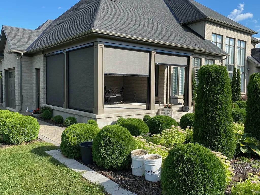 Detail of a motorized Talius retractable screen headbox cassette on a modern Ontario home