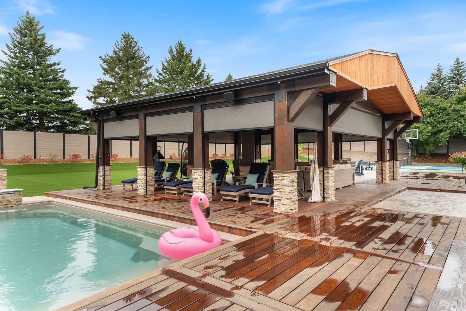 Pool cabana with deployed cream solar shades