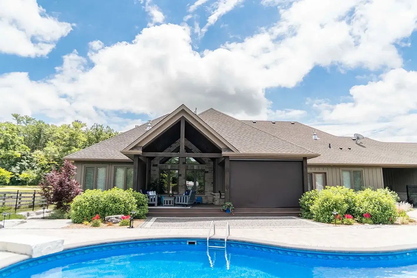 Timber-frame home with pool and retractable screens